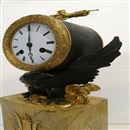 Early French Marble & Patinated Bronze Mantel Clock.  Circa 1825.